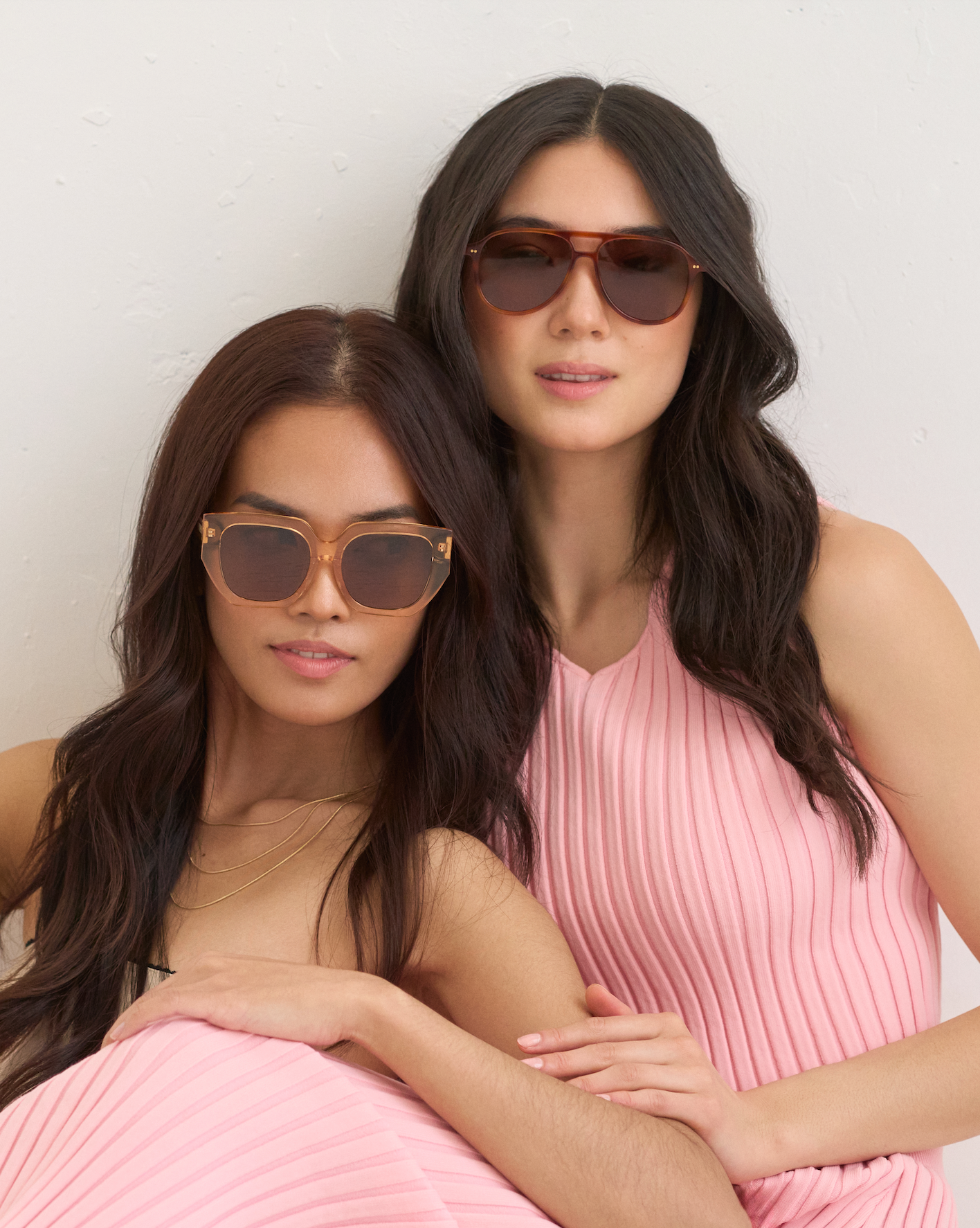 Two women wear KayTran Eyewears Knox - Cider sunglasses, posing together against a light background.