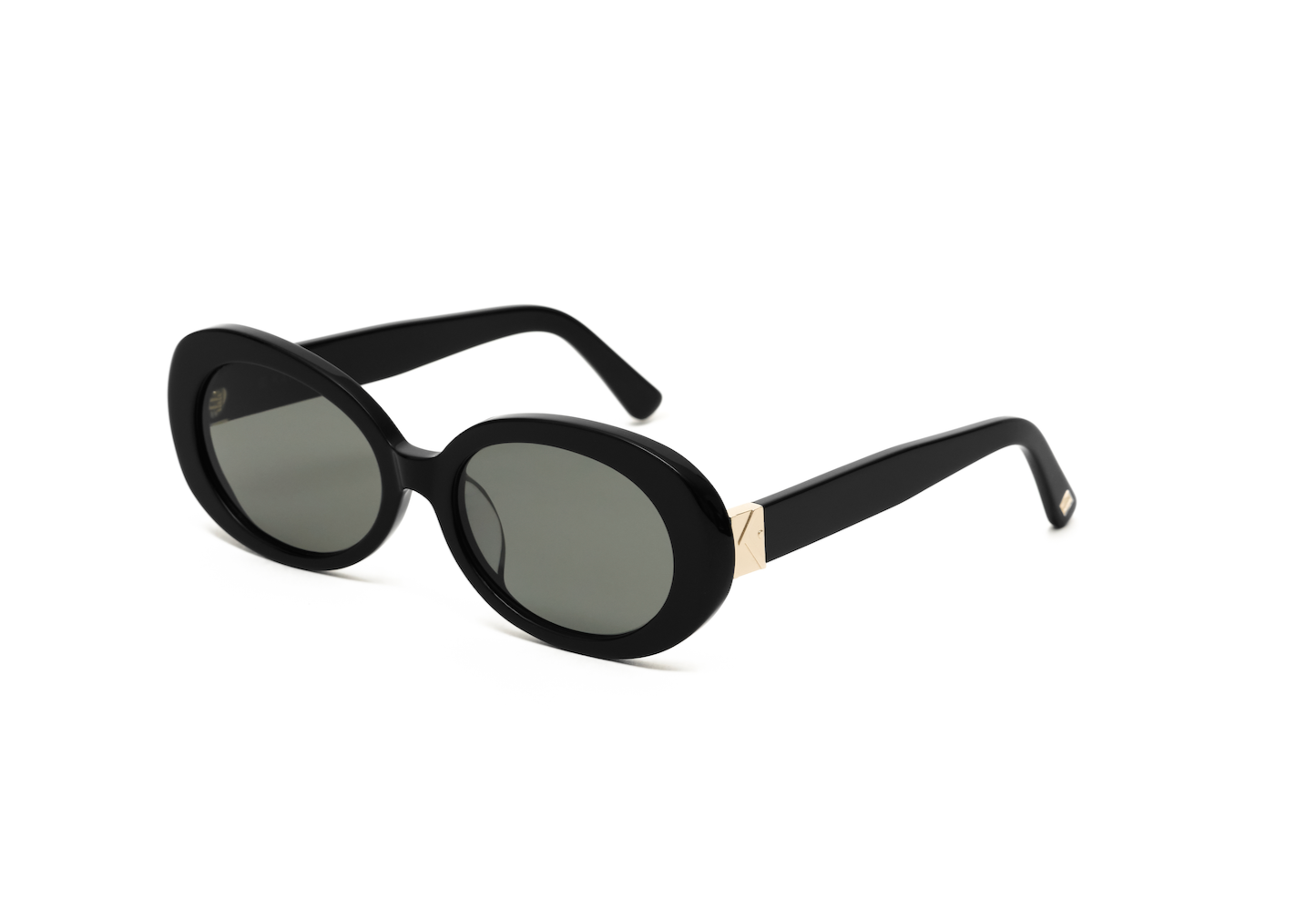 Mara - Polished Black sunglasses by KayTran Eyewear, oval with dark lenses and gold arms, on a white background.