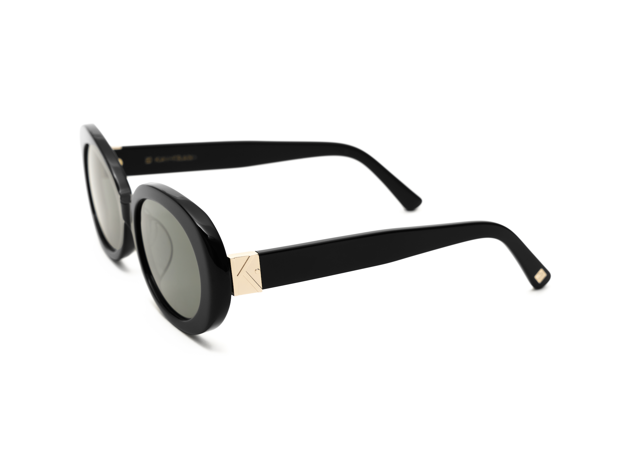 Mara - Polished Black by KayTran Eyewear: stylish round sunglasses with dark lenses and gold temple accents.