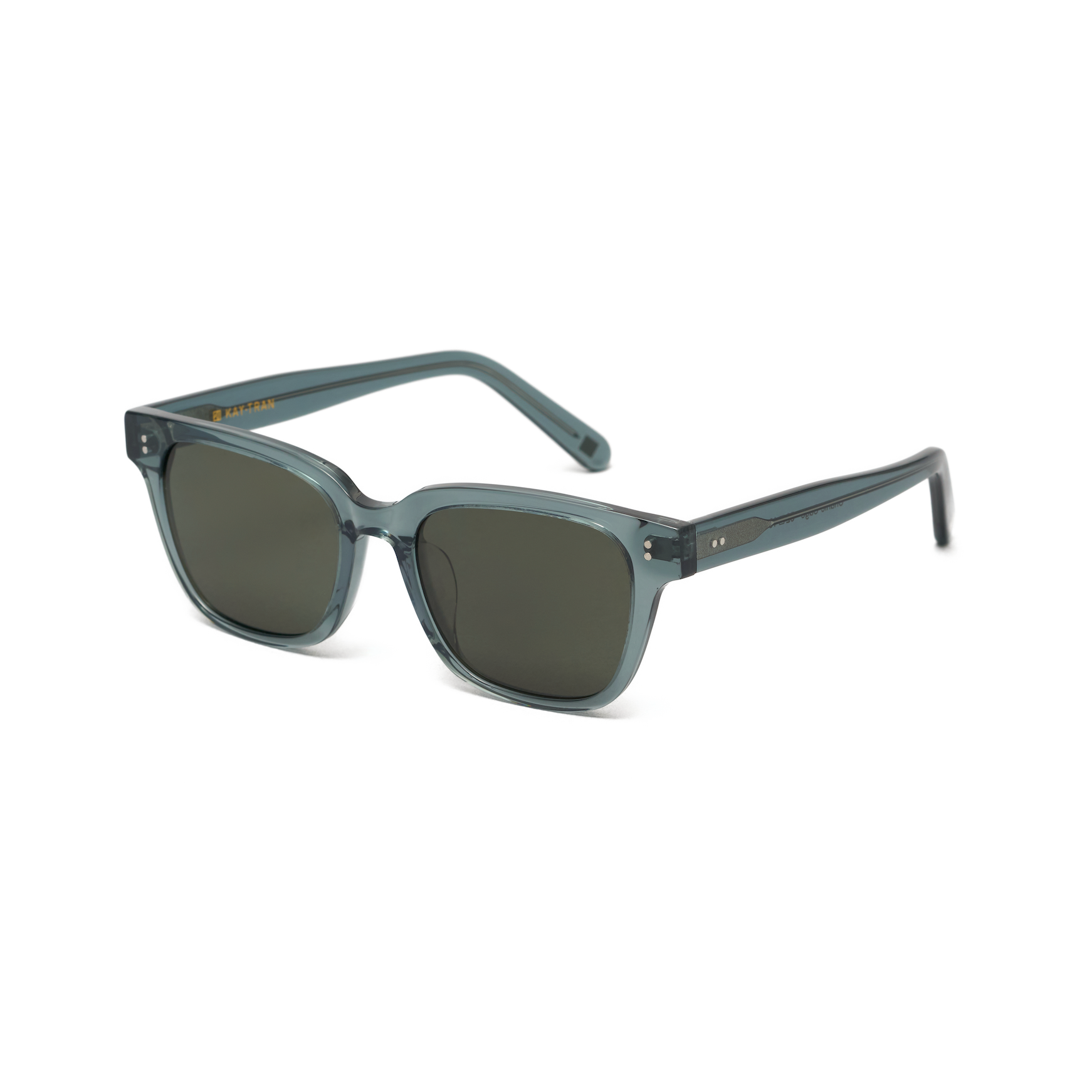 Charlie - Sage by KayTran Eyewear: square, translucent teal sunglasses with dark lenses and wide arms.