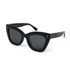KayTran Eyewear’s Arlo sunglasses feature polished black cat-eye frames and dark lenses on a white background.