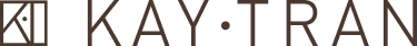 Logo with a geometric icon on the left and the text KAY·TRAN in capital letters on the right.