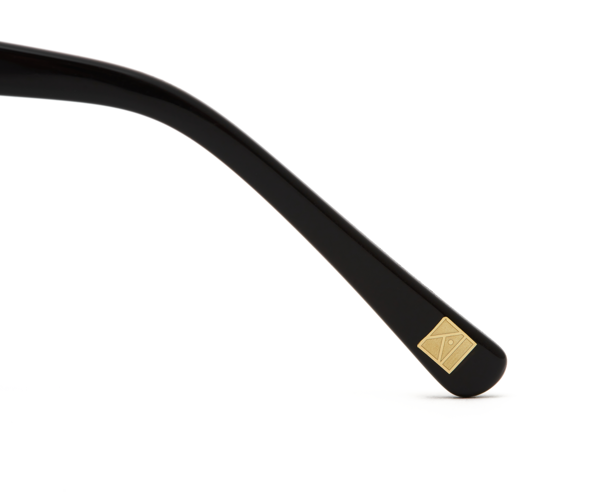 KayTran Eyewear Taylor - Polished Black temple arm features a small gold square detail near the tip on white background.