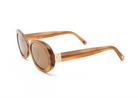 Mara - Latte by KayTran Eyewear: brown oval sunglasses with gold accents, displayed on a white background.