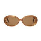 Mara - Latte sunglasses by KayTran Eyewear have brown translucent oval frames and tinted lenses, shown on white.