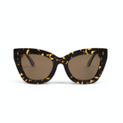 The Arlo - Amber Scale Tort cat-eye sunglasses by KayTran Eyewear feature brown lenses and tortoiseshell frames.